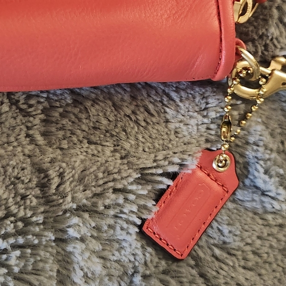 Like new Coach Large wristlet in redish or coral color - Picture 2 of 8